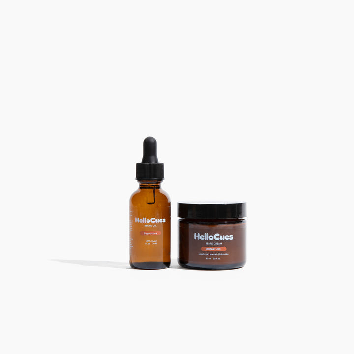 HelloCues Beard Care Set: an amber dropper bottle of beard oil beside an amber jar of beard cream.